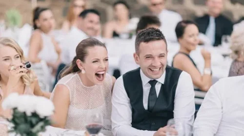 Newlyweds-laughing-at-wedding-sp